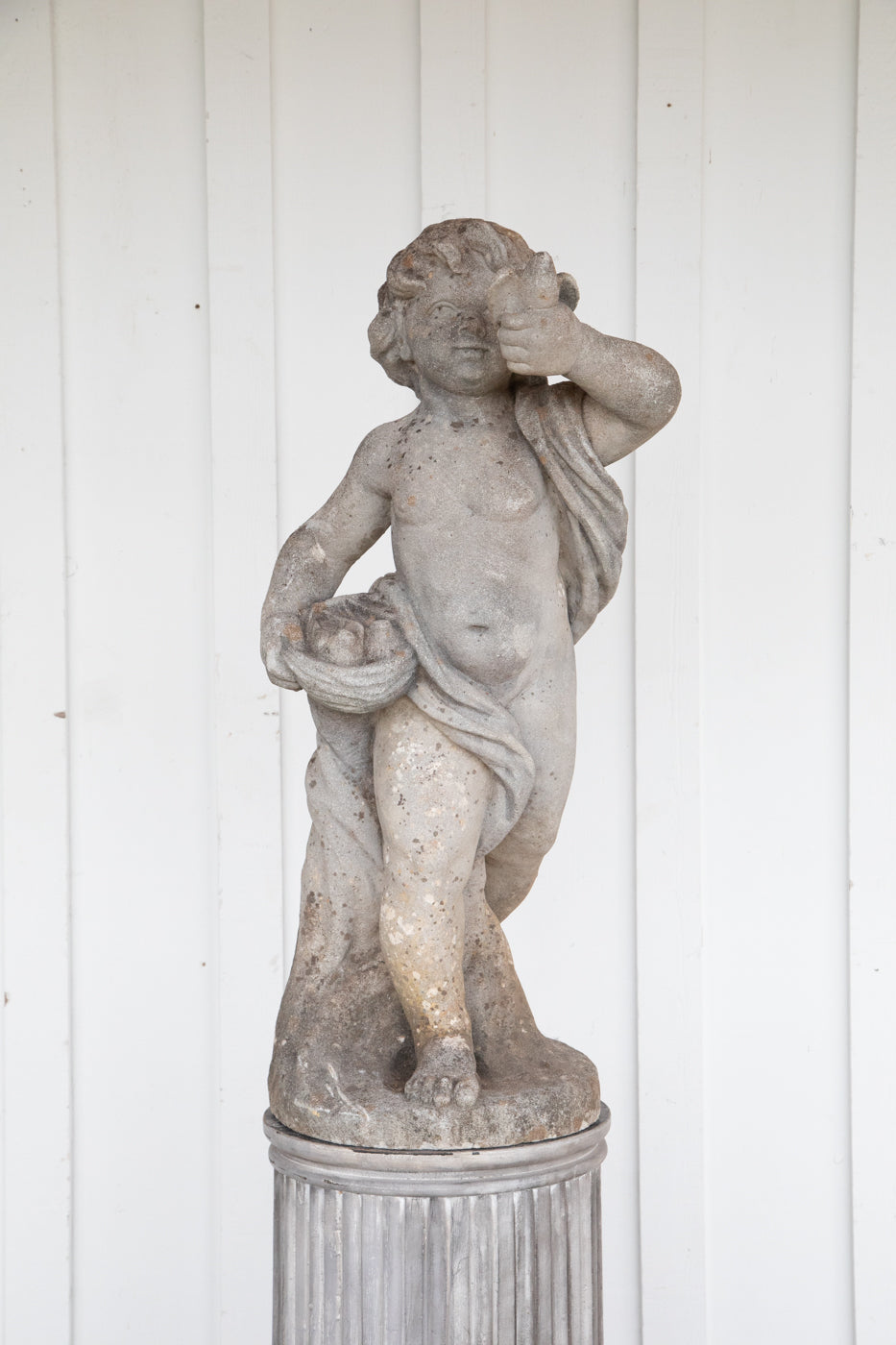 Concrete Cherub on wooden plinth