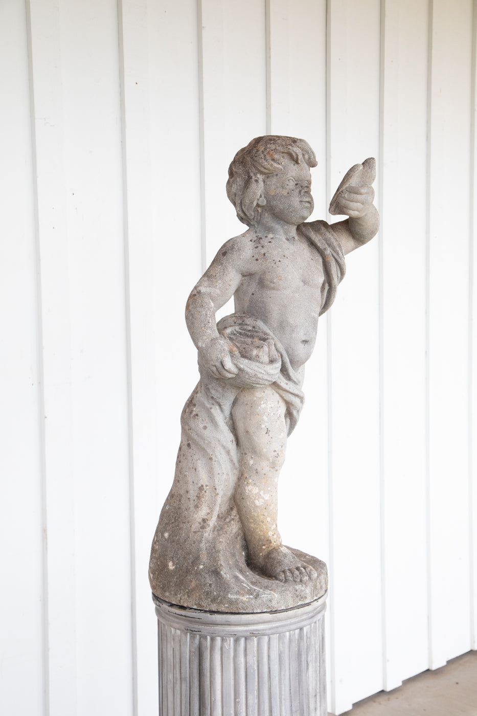 Concrete Cherub on wooden plinth